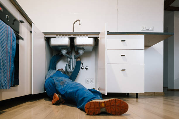 Professional Emergency Plumber technician working in Watkins, MN